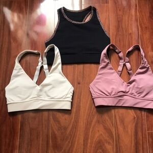 Fabletics Set of Three Sports Bras in Black, Cream, and Rose